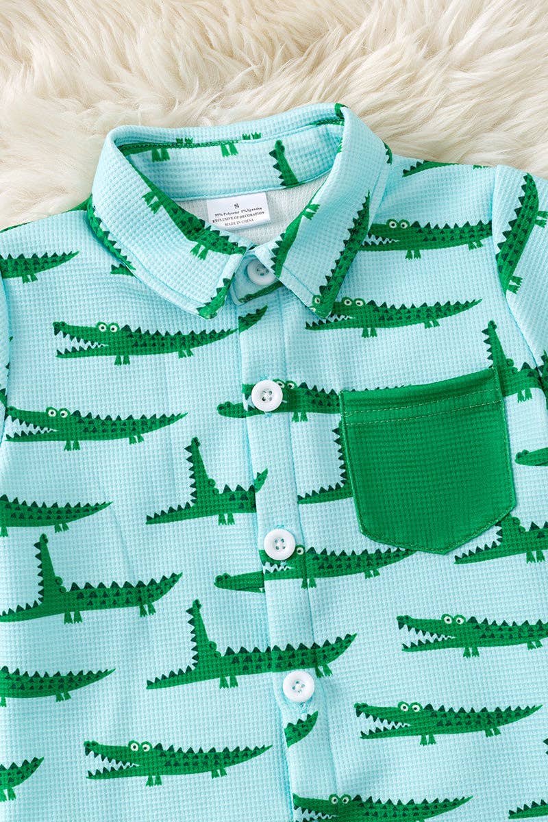 Cute crocodile printed on blue button up shirt and matching shorts.